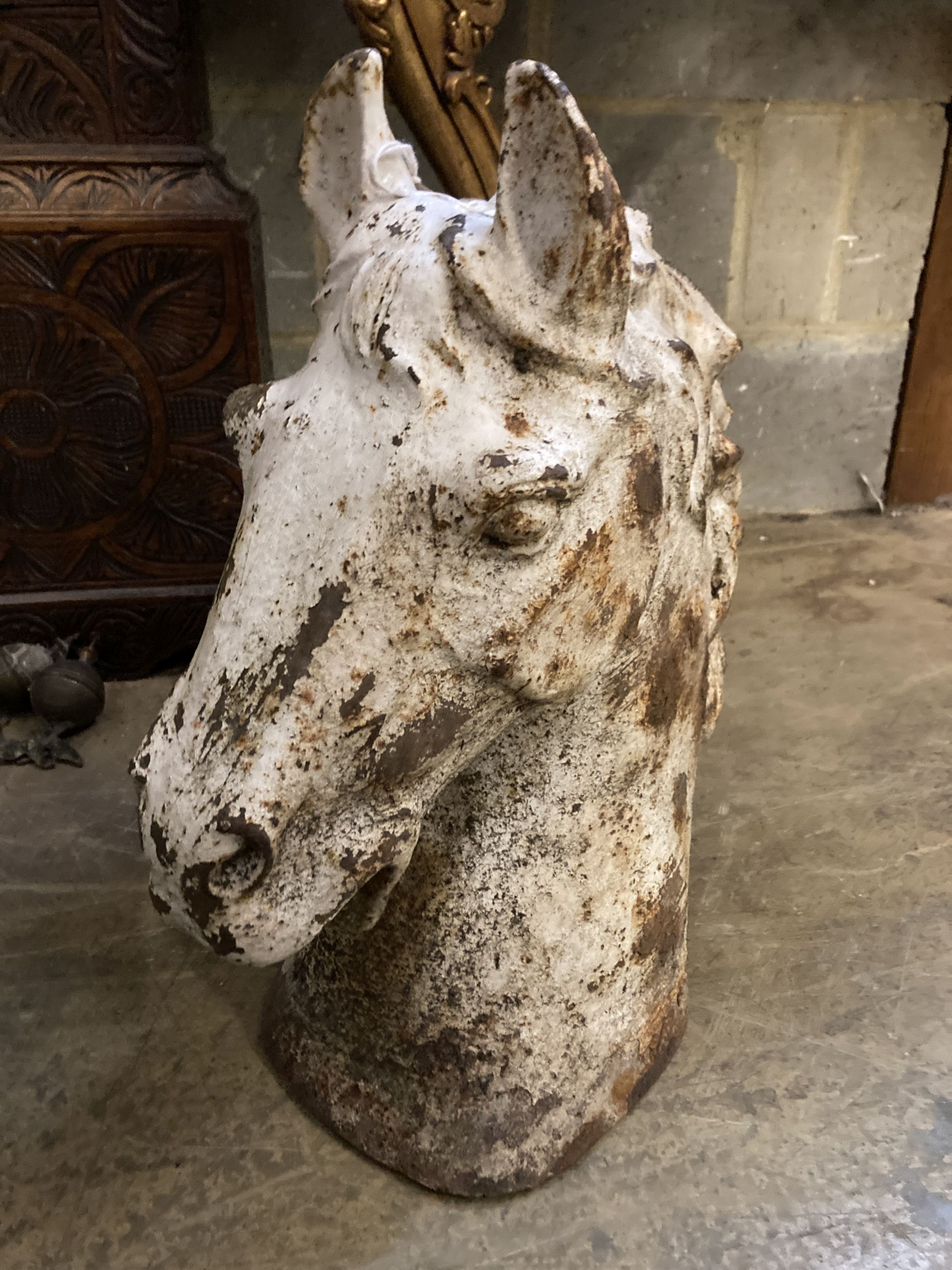 A cast iron horse head tethering post capitol, height 49cm